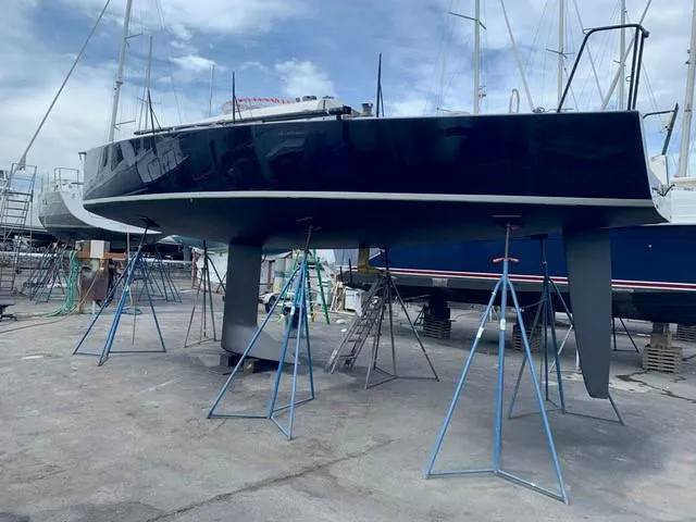 Slide: The Image of 2011 J Boats J/111 sailboat on stands in a boatyard. - 36
