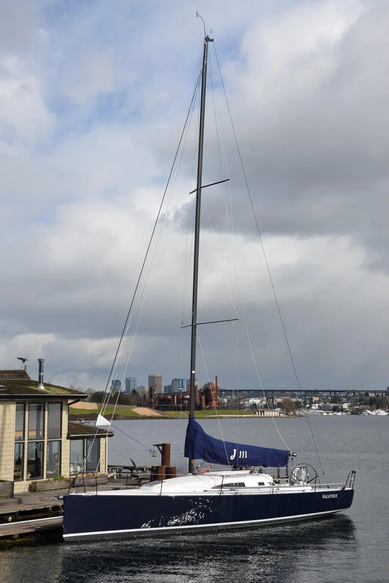 Slide: The Image of 2011 J Boats J/111 sailboat docked by a waterfront building. - 39
