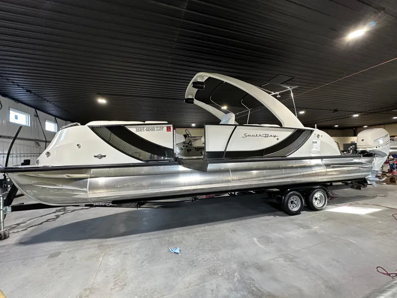 The Image of 2019 South Bay 25SPORT CR9 3.0 pontoon boat in indoor storage. - 0