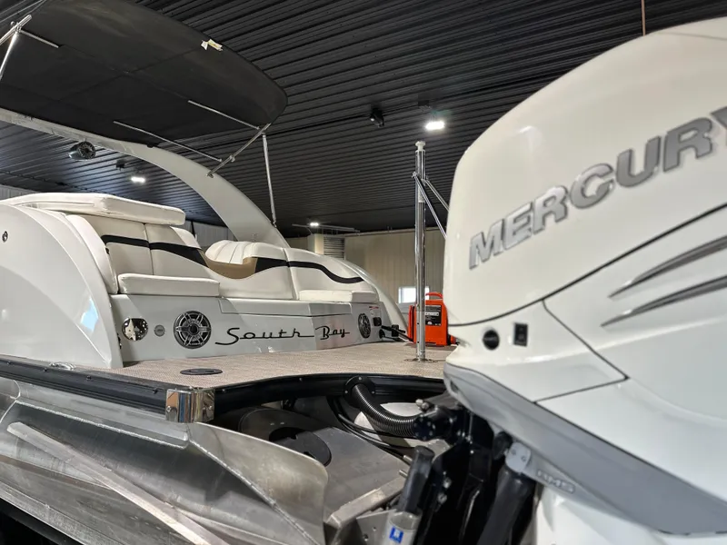 Slide: The Image of 2019 South Bay 25SPORT CR9 3.0 boat with Mercury engine in a showroom. - 13