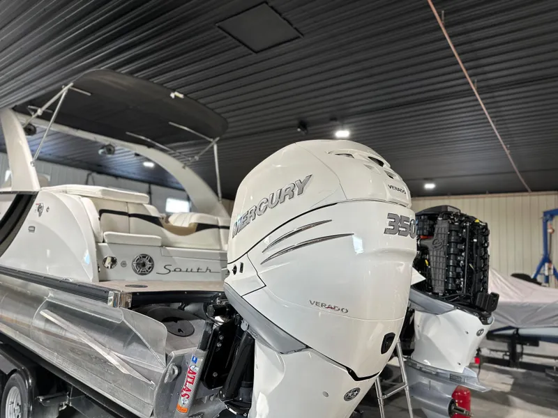 Slide: The Image of 2019 South Bay 25SPORT CR9 3.0 boat with Mercury 350 Verado engine in a garage. - 14
