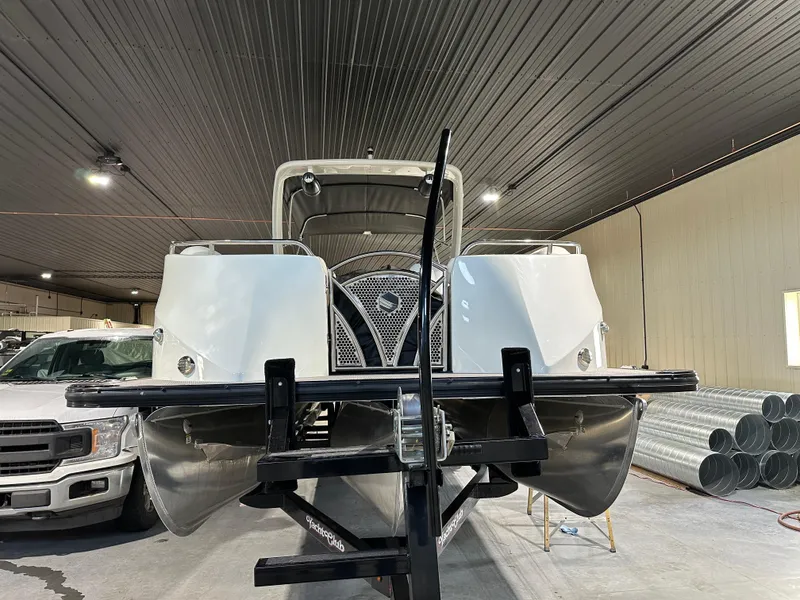 Slide: The Image of 2019 South Bay 25SPORT CR9 3.0 pontoon boat in indoor storage. - 2