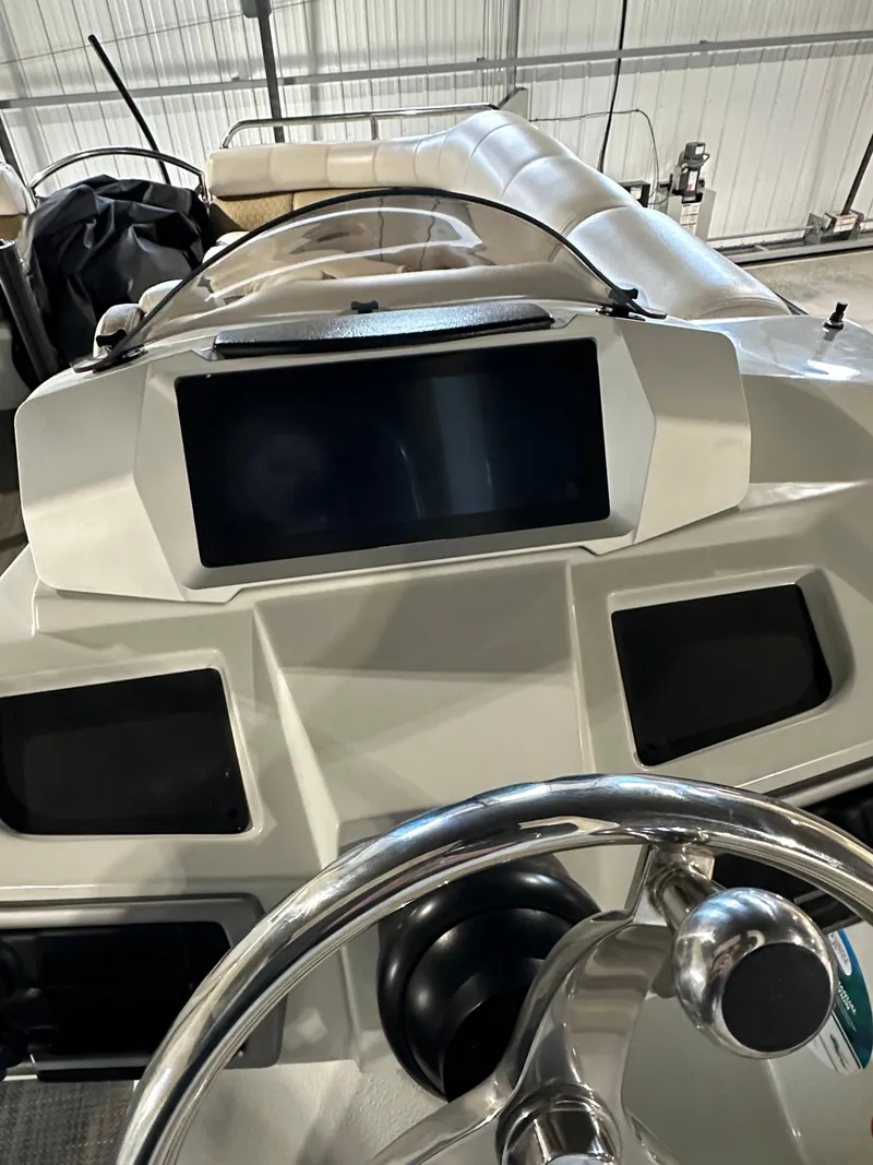Slide: The Image of 2019 South Bay 25SPORT CR9 3.0 boat dashboard with steering wheel and control panel. - 5