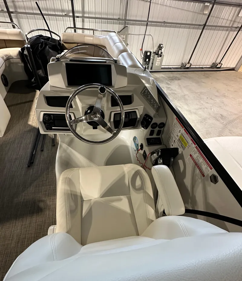 Slide: The Image of 2019 South Bay 25SPORT CR9 3.0 boat cockpit with steering wheel and control panel. - 6