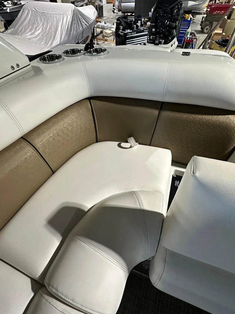 Slide: The Image of 2019 South Bay 25SPORT CR9 3.0 boat interior with white and beige seating. - 7
