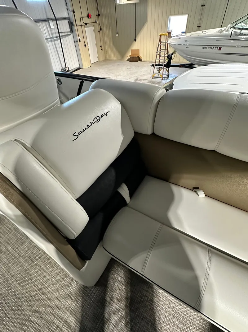 Slide: The Image of 2019 South Bay 25SPORT CR9 3.0 boat interior with white leather seats. - 8
