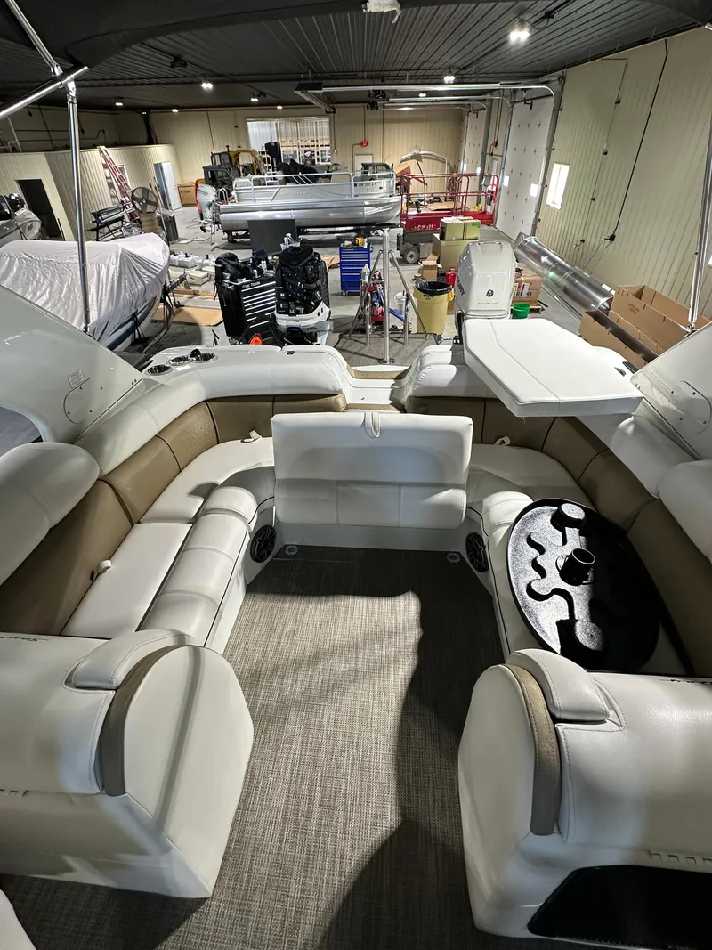 Slide: The Image of 2019 South Bay 25SPORT CR9 3.0 pontoon boat interior in a storage facility. - 9