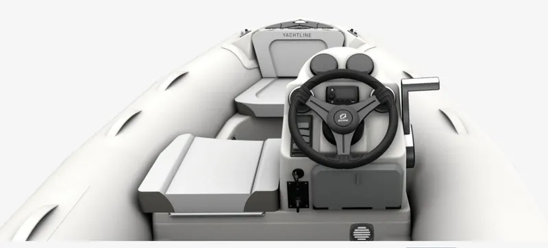 Slide: The Image of 2024 Zodiac Yachtline 360 inflatable boat interior with steering wheel and seating. - 10