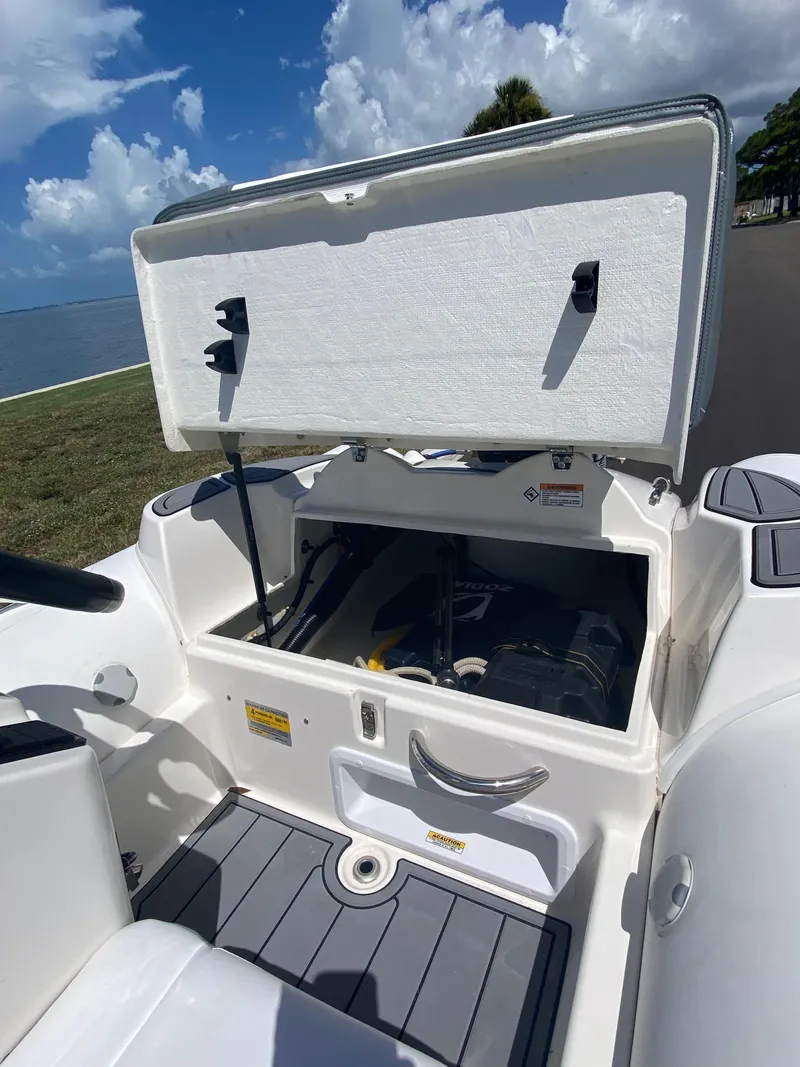 Slide: The Image of Open storage compartment on a 2024 Zodiac Yachtline 360 boat. - 5