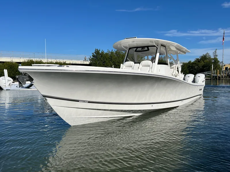 Slide: The Image of 2024 Regulator 41 boat on calm water, showcasing sleek design and modern features. - 15