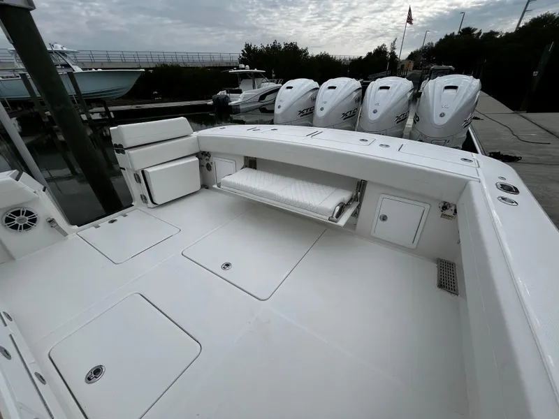 Slide: The Image of 2024 Regulator 41 boat deck with quad engines at dock. - 19