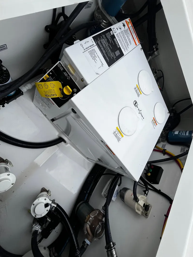 Slide: The Image of Electrical system components in the engine room of a 2024 Regulator 41 boat. - 21