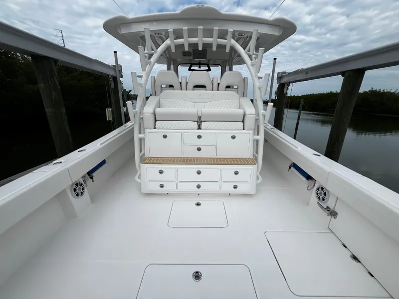 Slide: The Image of 2024 Regulator 41 boat interior with seating and storage compartments. - 22