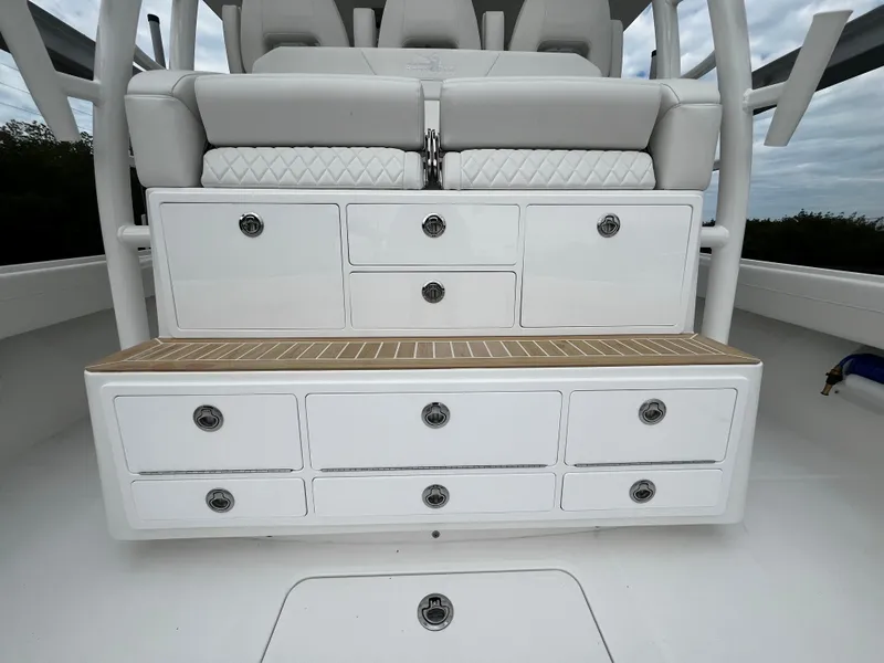 Slide: The Image of 2024 Regulator 41 boat storage compartments and seating area - 24