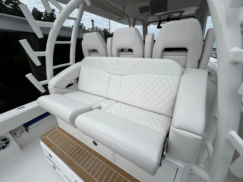 Slide: The Image of Luxurious seating on the 2024 Regulator 41 boat with white quilted upholstery. - 25