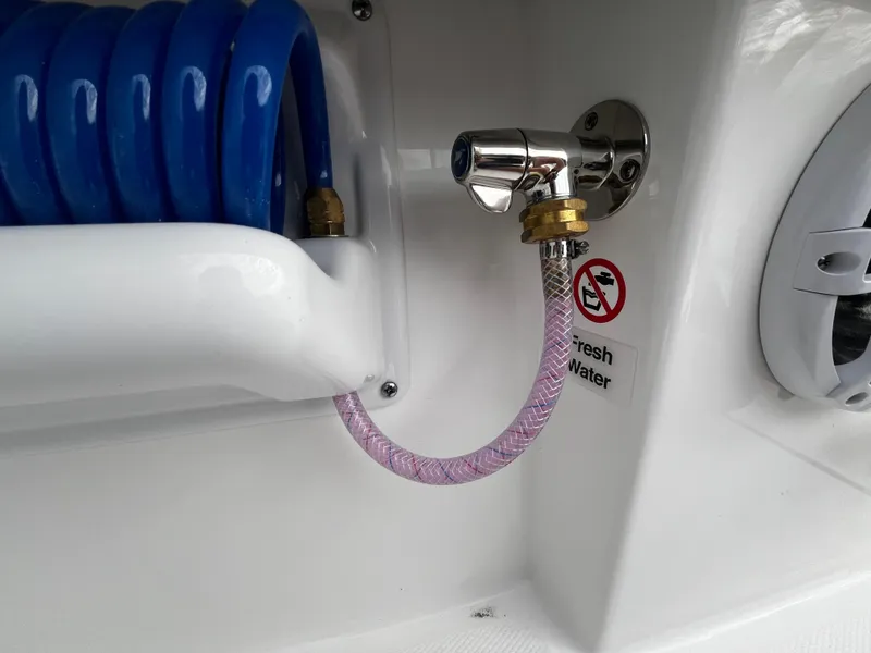 Slide: The Image of Freshwater hose connection on a 2024 Regulator 41 boat. - 33