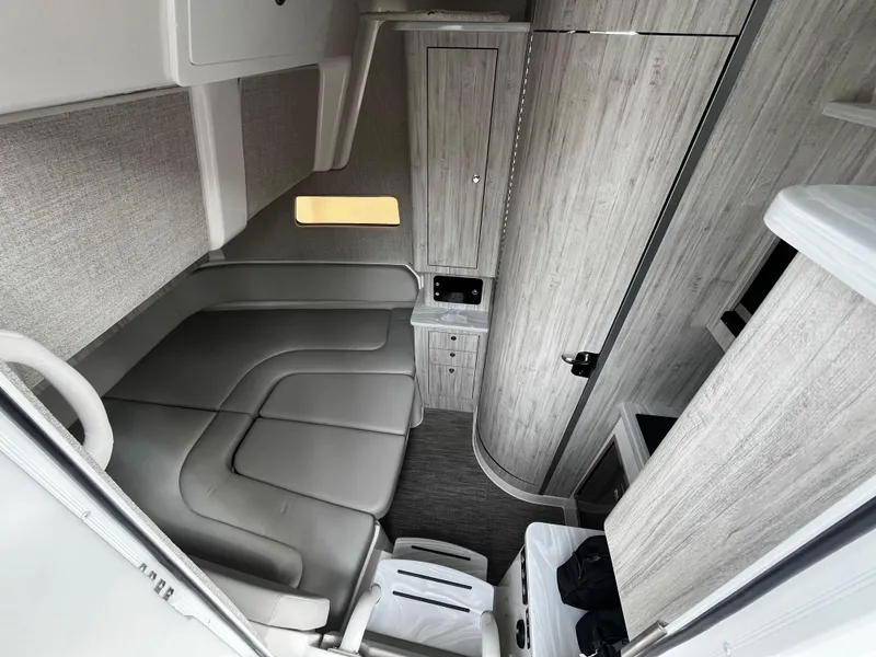 Slide: The Image of 2024 Regulator 41 boat interior with modern seating and wood paneling. - 37