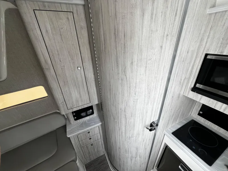 Slide: The Image of 2024 Regulator 41 interior cabin with modern kitchen and storage. - 41
