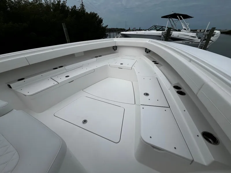 Slide: The Image of 2024 Regulator 41 boat with spacious seating and storage compartments. - 49