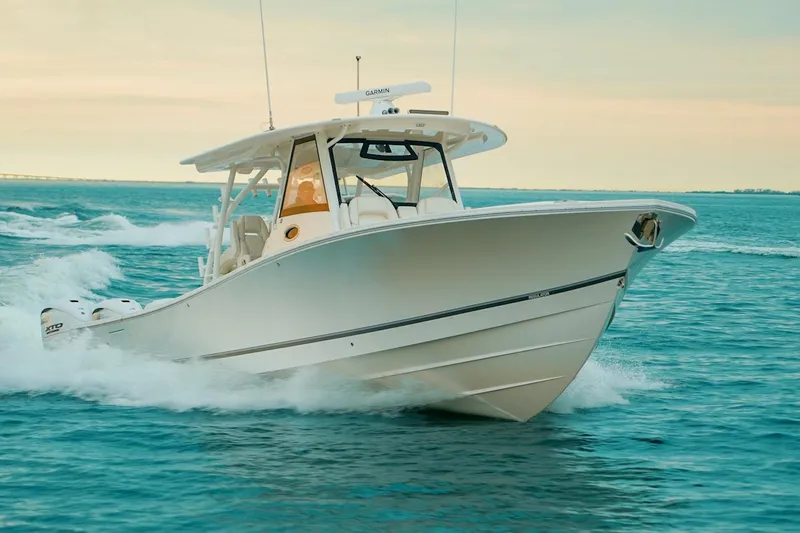 Slide: The Image of 2024 Regulator 41 boat cruising on open water, showcasing sleek design and powerful performance. - 56