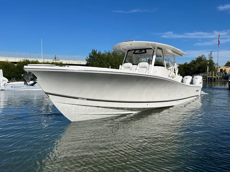 Slide: The Image of 2024 Regulator 41 boat on calm water under clear blue sky. - 9