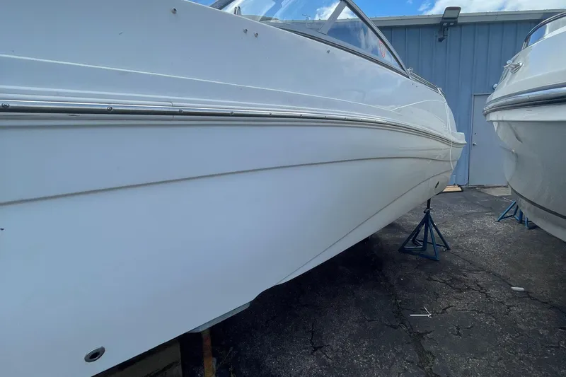Slide: The Image of 2019 Hurricane 217 Sundeck boat on stands, side view. - 4