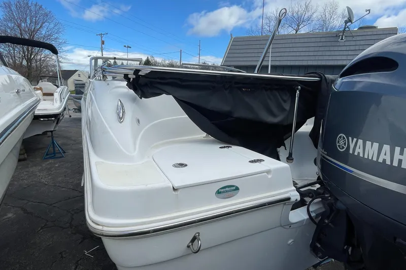 Slide: The Image of 2019 Hurricane 217 Sundeck boat with Yamaha outboard motor, docked outdoors. - 6