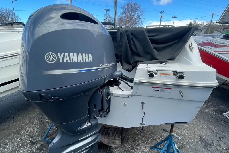 Slide: The Image of 2019 Hurricane 217 Sundeck with Yamaha outboard motor in a boatyard. - 7