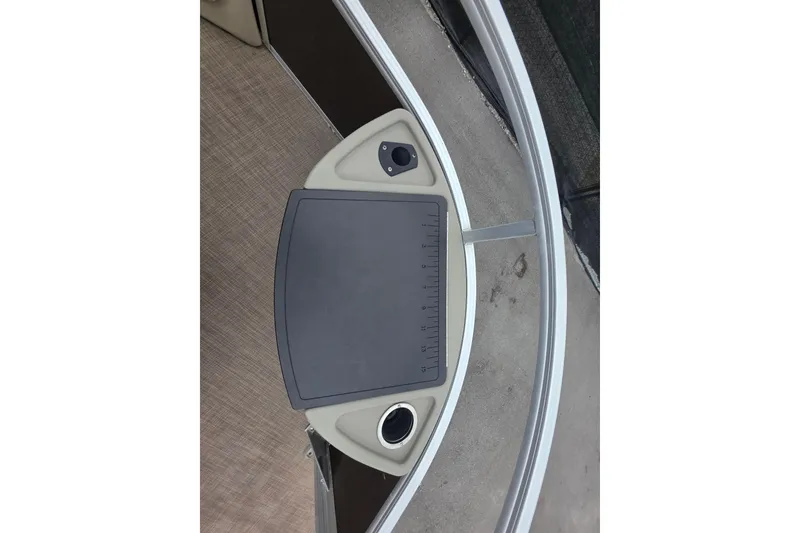 Slide: The Image of 2023 Sun Tracker Bass Buggy 18 DLX deck with ruler and cup holder. - 37