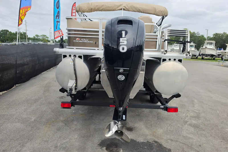 Slide: The Image of 2023 Sun Tracker Bass Buggy 18 DLX pontoon boat with Mercury 150 engine, displayed for sale. - 4