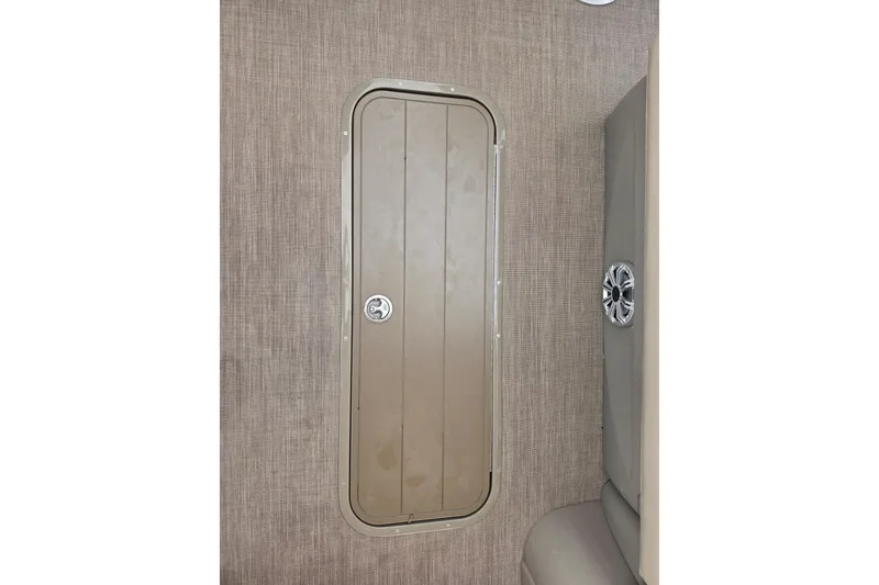 Slide: The Image of 2023 Sun Tracker Bass Buggy 18 DLX boat interior with storage compartment and speaker. - 42