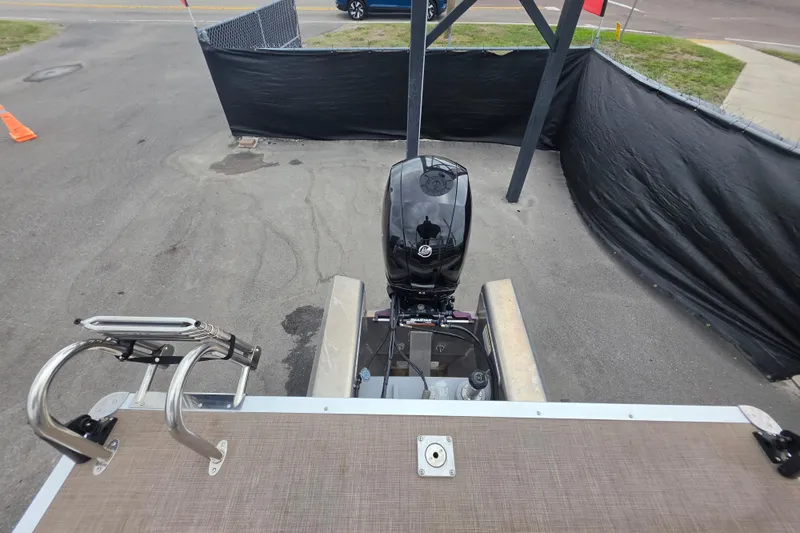 Slide: The Image of 2023 Sun Tracker Bass Buggy 18 DLX pontoon boat with outboard motor, rear view. - 62