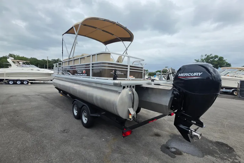 Slide: The Image of 2023 Sun Tracker Bass Buggy 18 DLX pontoon boat with Mercury outboard motor. - 7