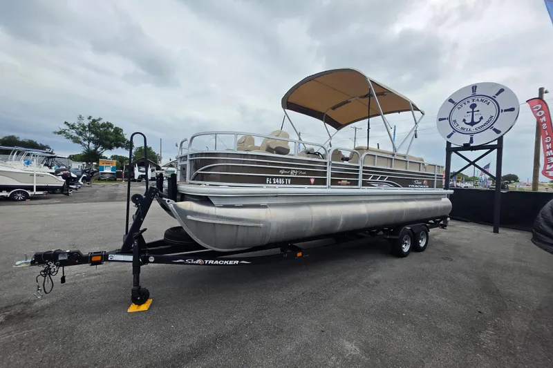 Slide: The Image of 2023 Sun Tracker Bass Buggy 18 DLX pontoon boat on trailer at dealership. - 9