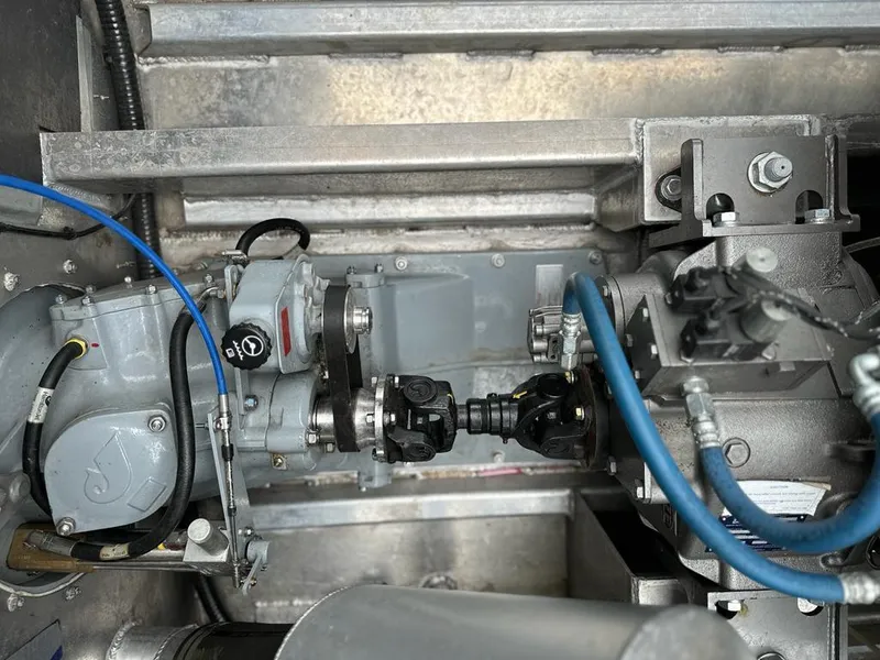 Slide: The Image of Engine compartment of a 2014 Wooldridge 31 boat with visible mechanical components. - 12