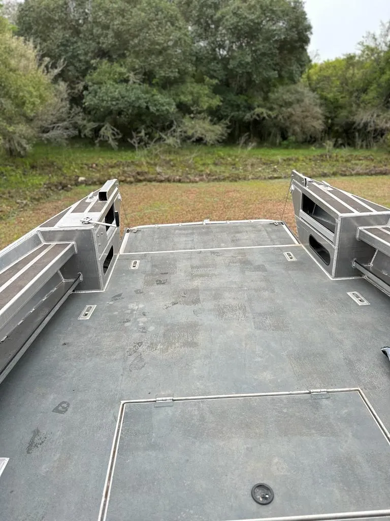 Slide: The Image of 2014 Wooldridge 31 boat deck with forest background. - 5