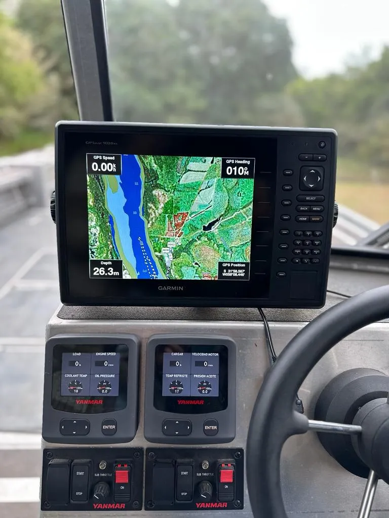 Slide: The Image of Garmin GPS navigation system on a 2014 Wooldridge 31 boat dashboard. - 8