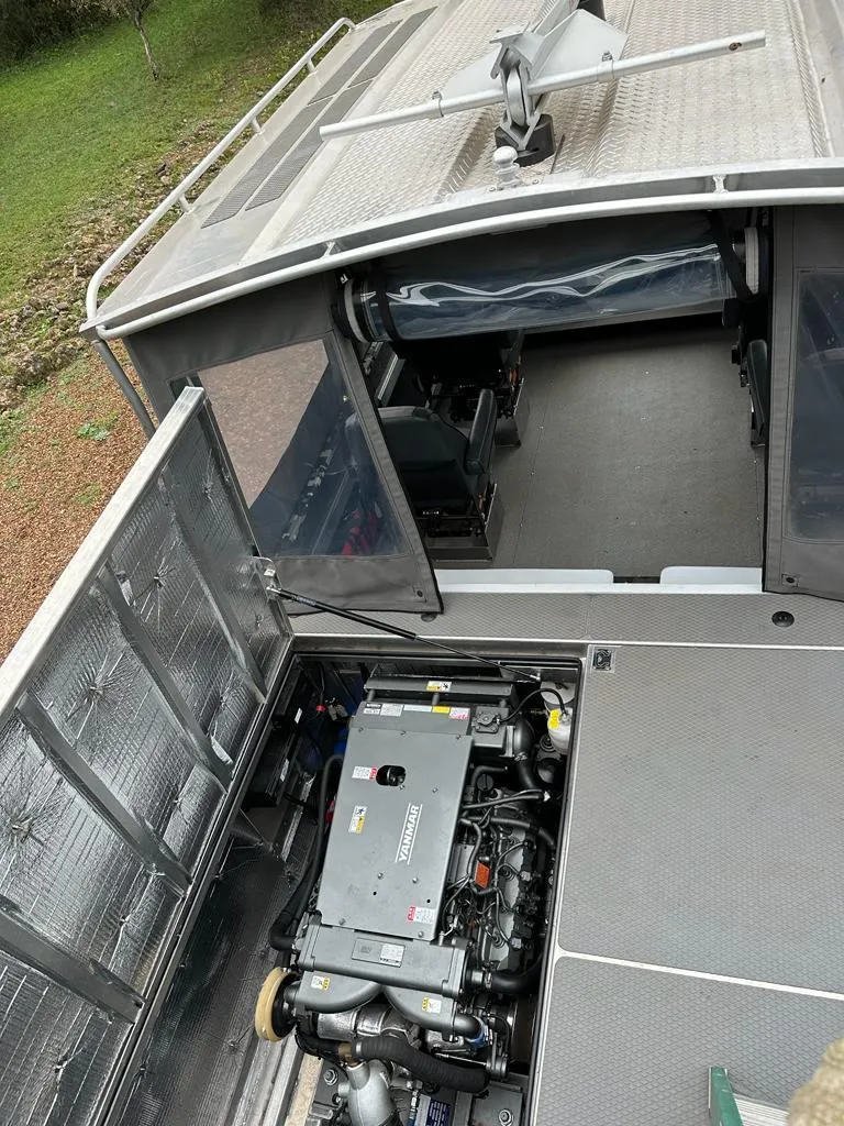 Slide: The Image of 2014 Wooldridge 31 boat with open engine compartment and interior view. - 9