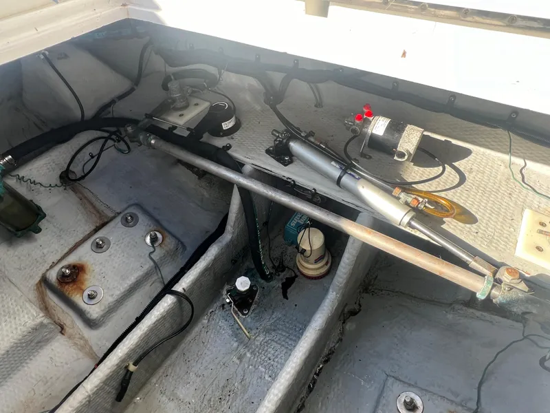 Slide: The Image of 1995 Luhrs Tournament 290 Open boat interior showing mechanical components. - 10