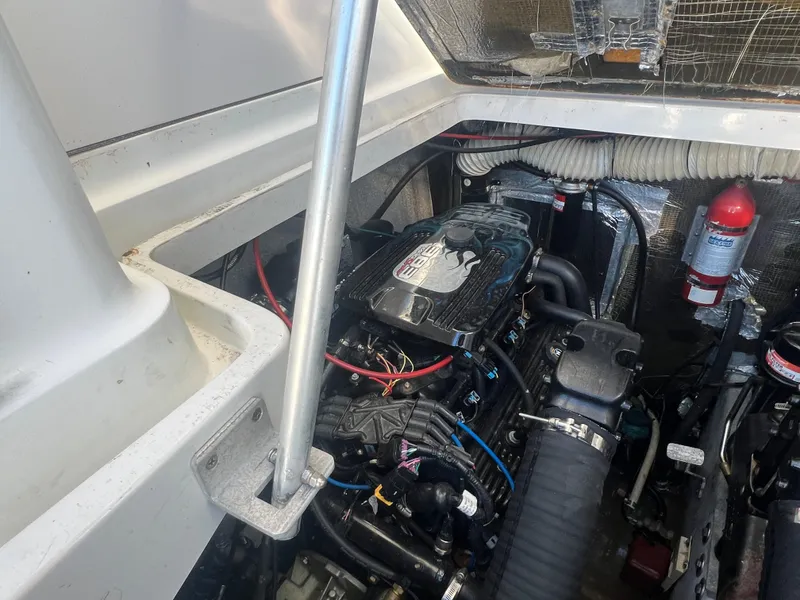 Slide: The Image of 1995 Luhrs Tournament 290 Open engine compartment with visible components. - 11