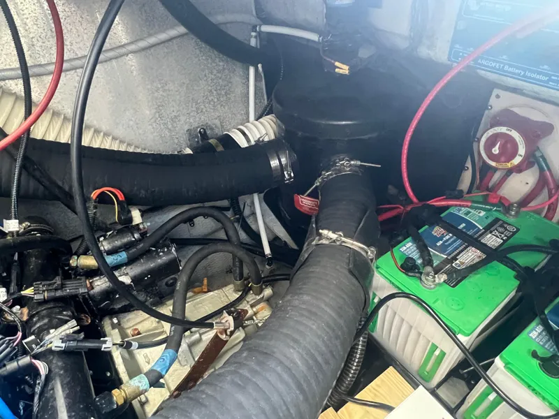 Slide: The Image of 1995 Luhrs Tournament 290 Open engine compartment with batteries and wiring. - 14