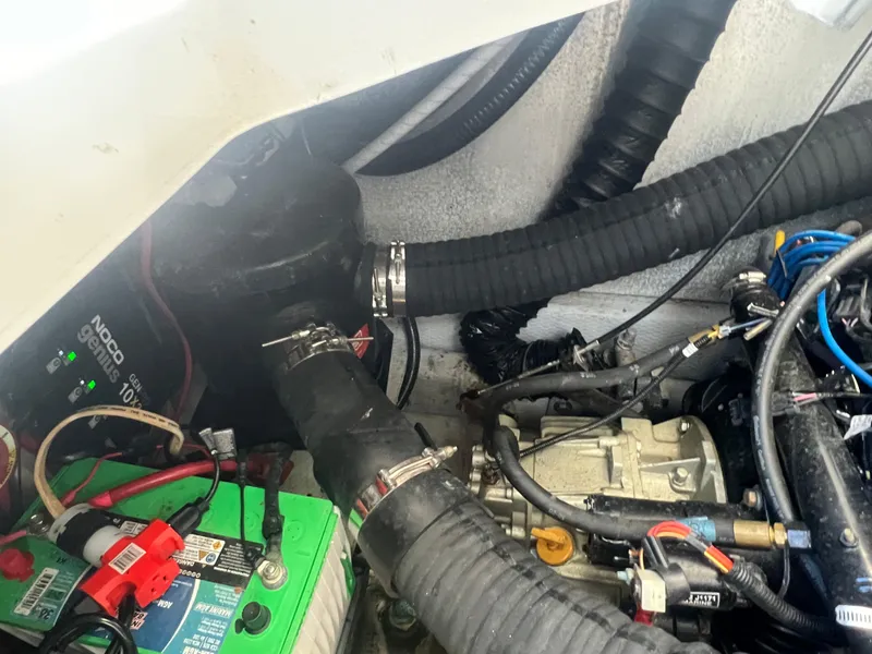 Slide: The Image of 1995 Luhrs Tournament 290 Open engine compartment with battery and hoses. - 15