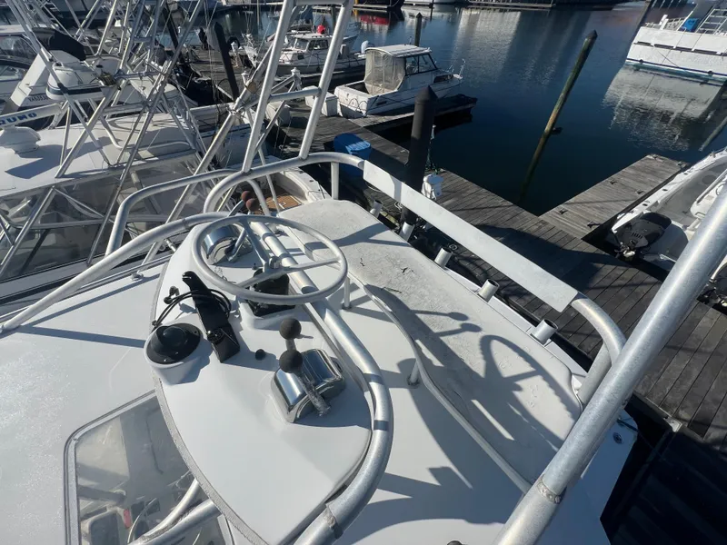 Slide: The Image of 1995 Luhrs Tournament 290 Open boat docked at marina, aerial view of helm. - 27