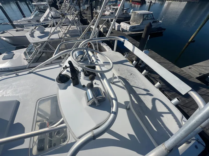 Slide: The Image of 1995 Luhrs Tournament 290 Open boat helm station at marina. - 28