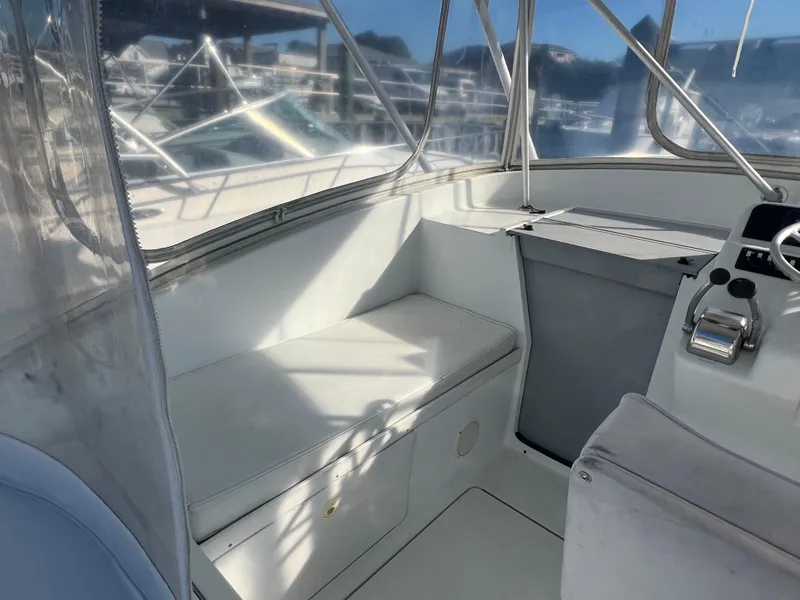 Slide: The Image of 1995 Luhrs Tournament 290 Open boat interior with seating and control panel. - 4