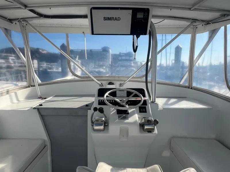 Slide: The Image of 1995 Luhrs Tournament 290 Open helm with Simrad electronics. - 5