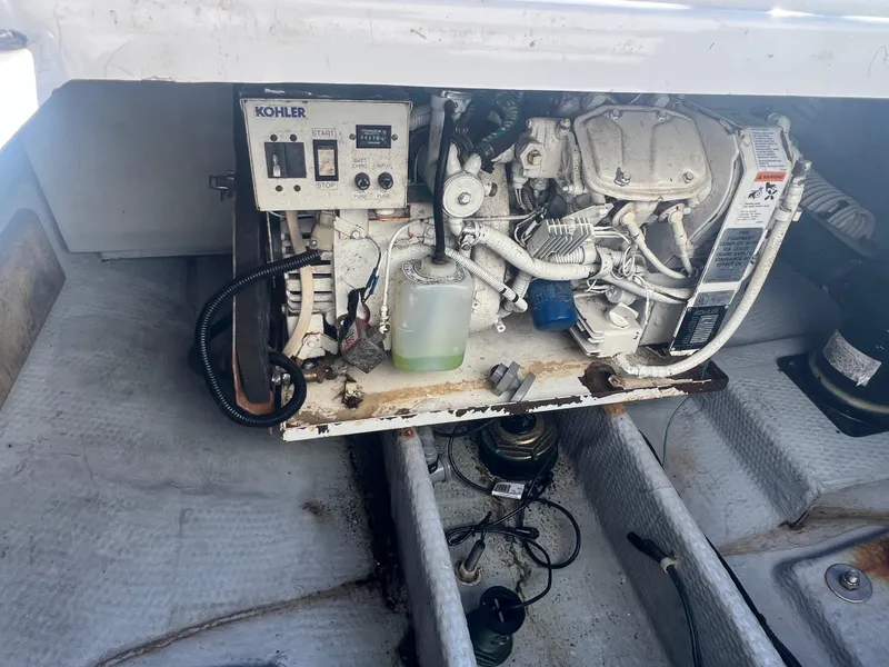 Slide: The Image of Engine compartment of a 1995 Luhrs Tournament 290 Open boat with Kohler generator. - 8