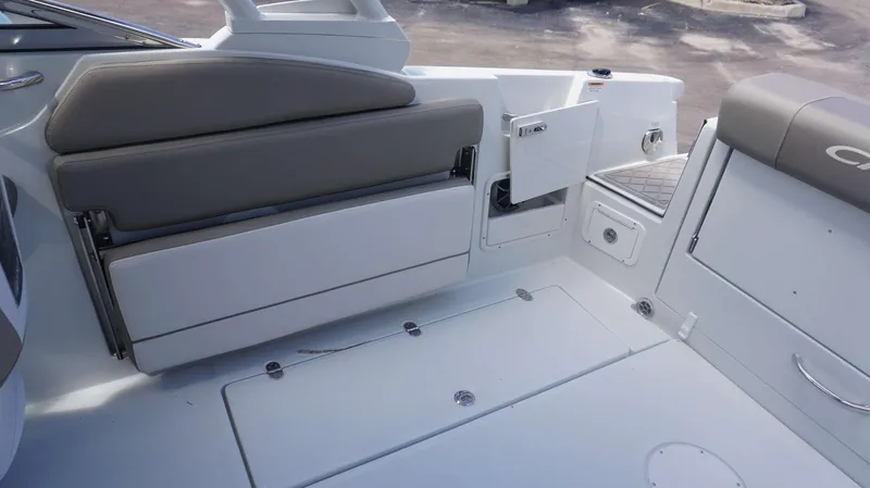 Slide: The Image of 2024 Crownline 240 DC boat interior with seating and storage compartments. - 10