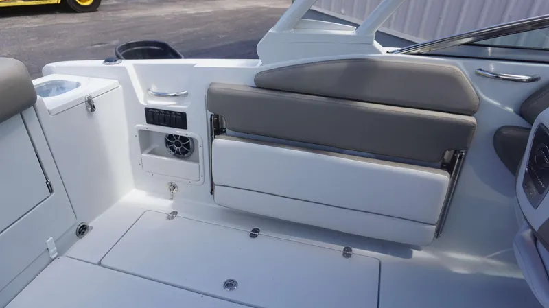 Slide: The Image of 2024 Crownline 240 DC boat interior with seating and storage compartments. - 11