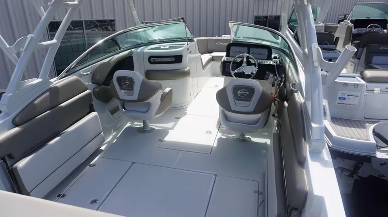 Slide: The Image of 2024 Crownline 240 DC boat interior with modern seating and dashboard. - 3